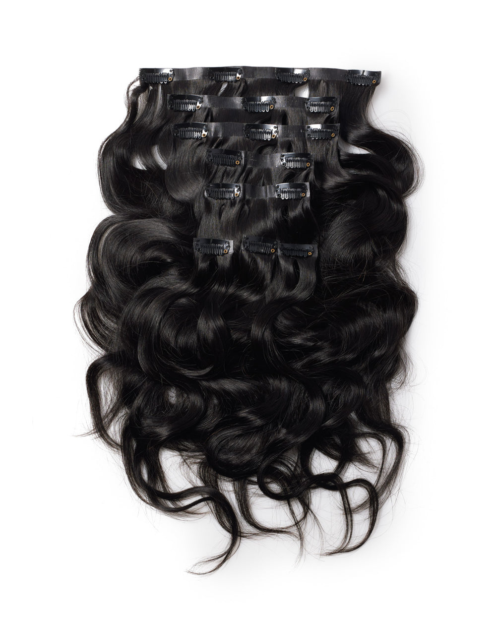 Top view flat lay of Go Sleek’s Seamless body wave Clip-Ins, showing 8 separate wefts with visible clips. Each piece features a natural kinky straight texture and seamless, flat bases designed for undetectable blending.